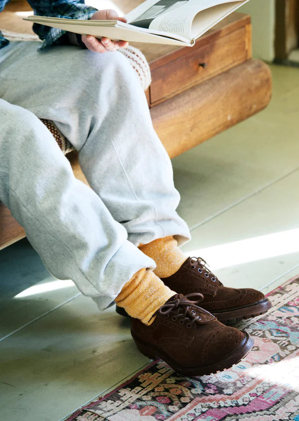 Close up of man wearing Rototo Double Face Crew Socks in yellow